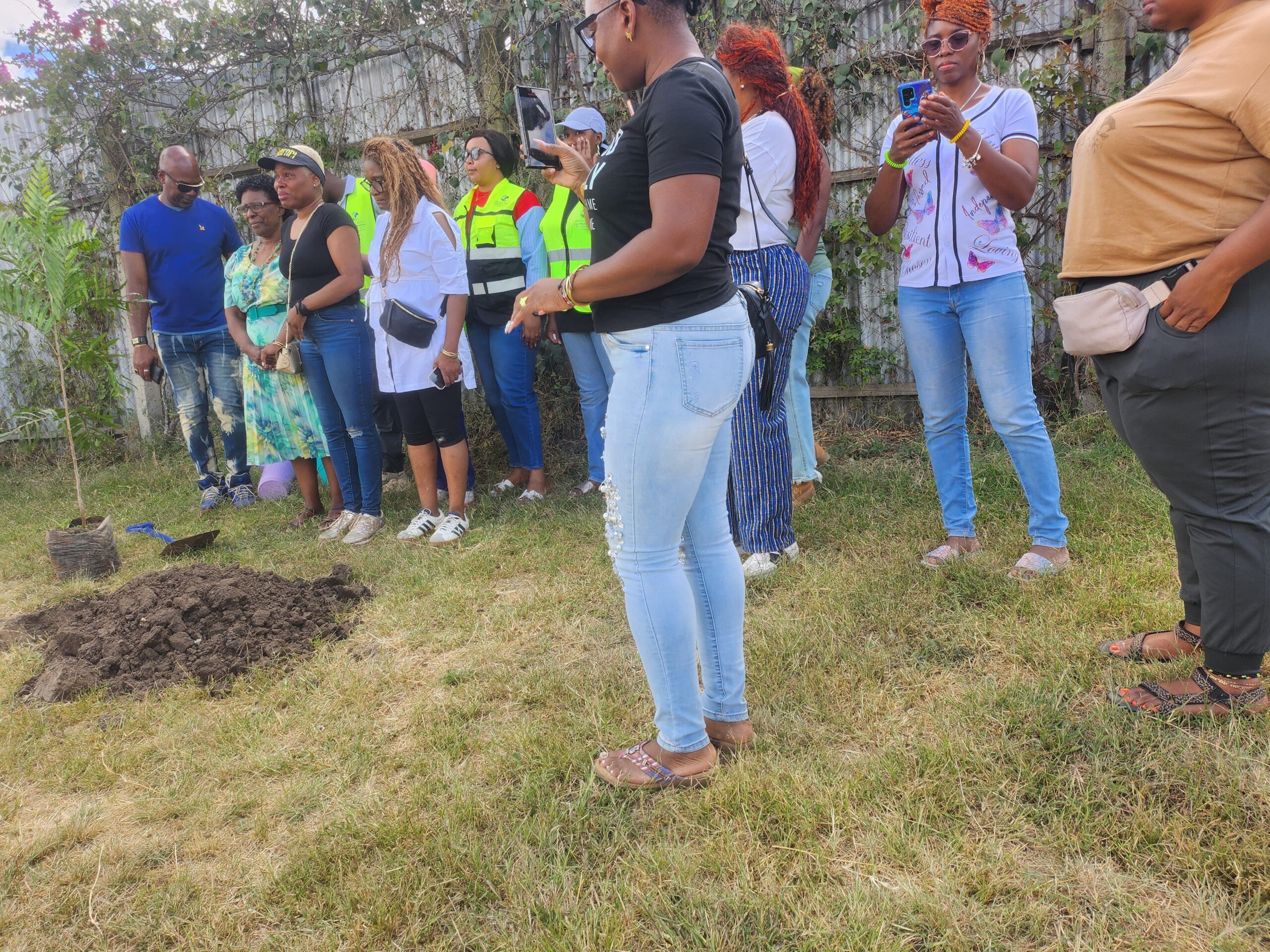 Global Relief for Humanity team members, US visitors and teachers planting trees at the Brydges Center