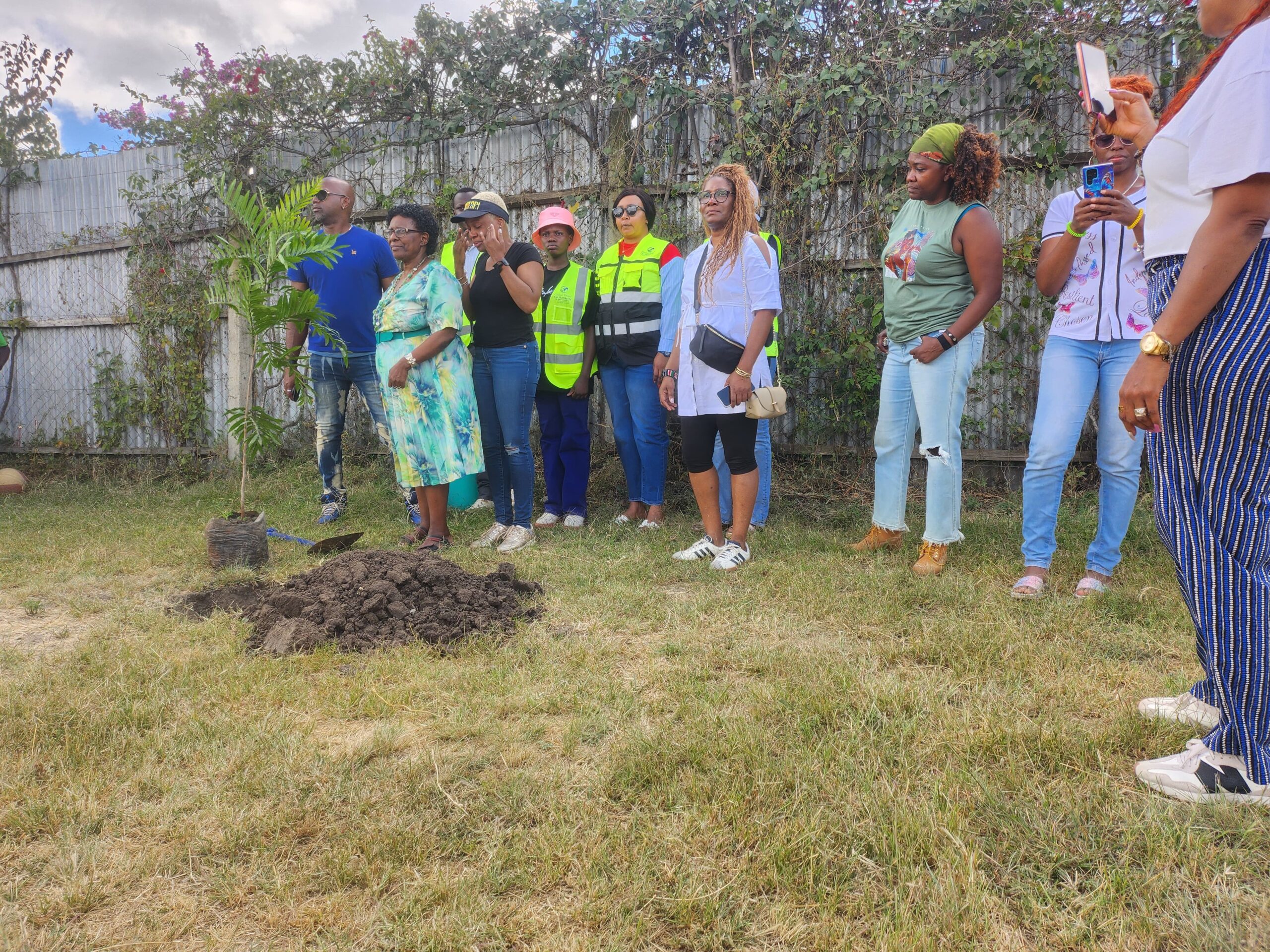 Global Relief for Humanity team members, US visitors and teachers planting trees at the Brydges